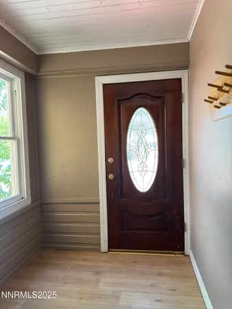 a view of entryway with wooden floor
