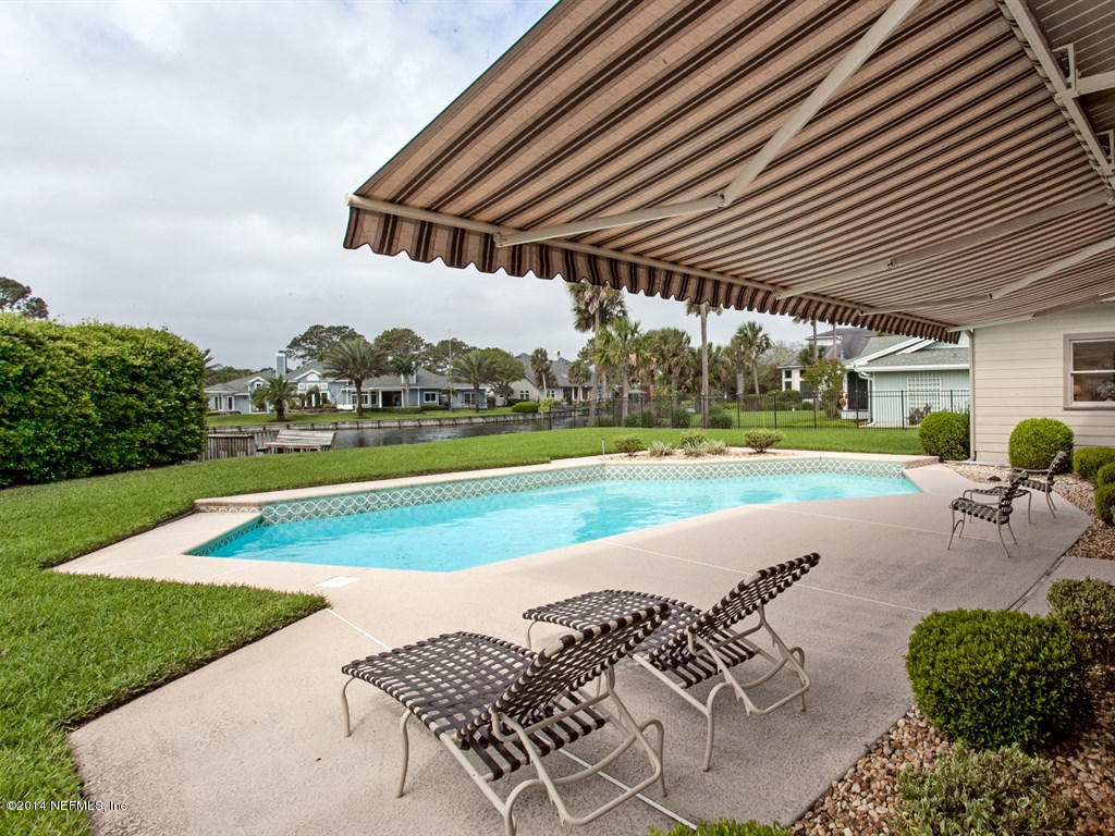 542 Lake Road Ponte Vedra Beach, FL 32082 - Photo 34 of 37 034_Patio with Electric Awning Extended