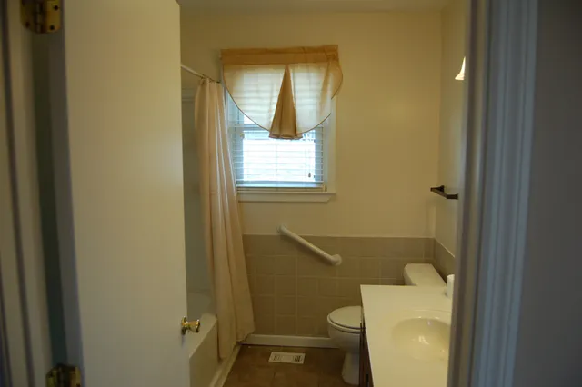 a bathroom with a toilet and a sink