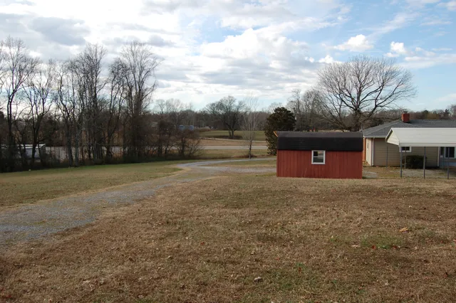 a view of a yard with an trees