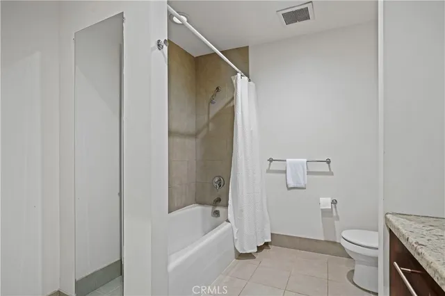a bathroom with a toilet and a bathtub