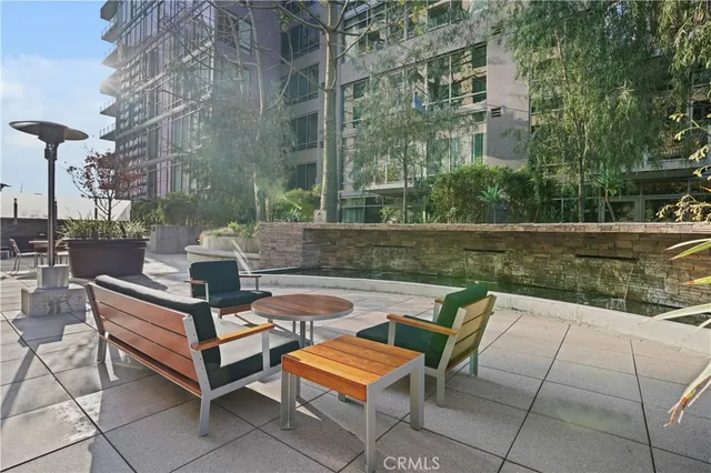 a swimming pool with outdoor seating and yard