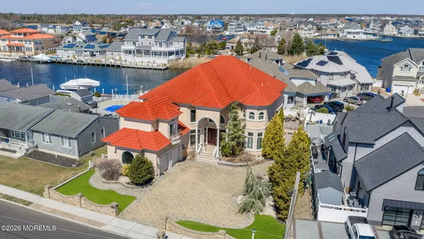 an aerial view of multiple houses with outdoor space