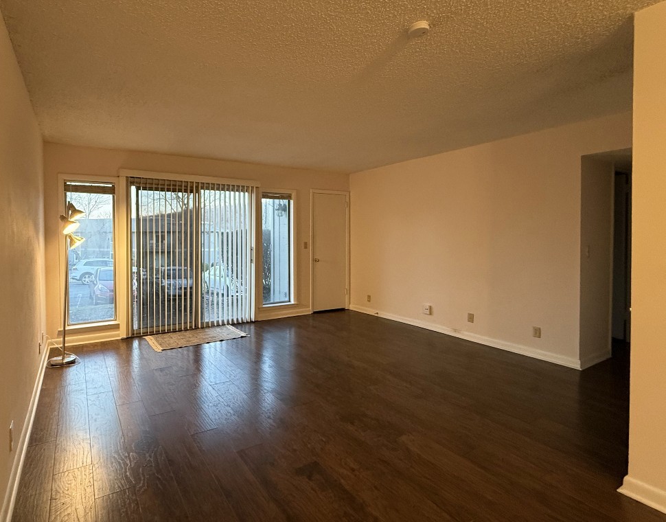 21 Vaughns Gap Road, Unit 146 Nashville, TN 37205 - Photo 2 of 14 a view of an empty room with wooden floor and a window