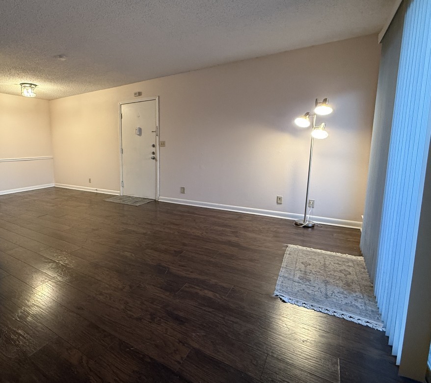 21 Vaughns Gap Road, Unit 146 Nashville, TN 37205 - Photo 3 of 14 an empty room with wooden floor and windows