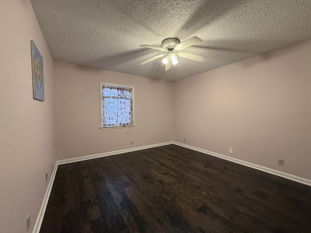 21 Vaughns Gap Road, Unit 146 Nashville, TN 37205 - Photo 6 of 14 an empty room with wooden floor fan and windows