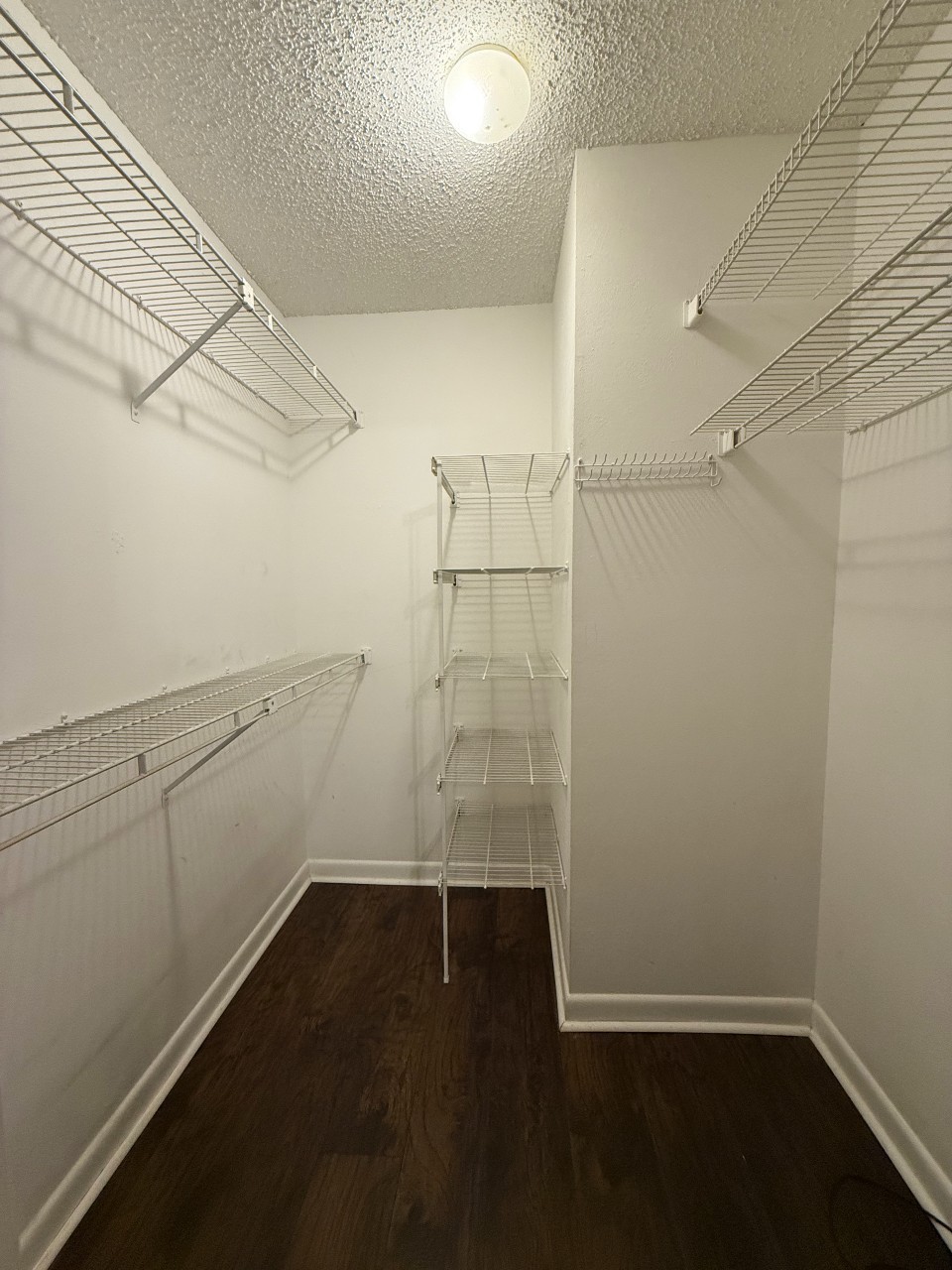 21 Vaughns Gap Road, Unit 146 Nashville, TN 37205 - Photo 7 of 14 a view of a room with racks on the wall and shower
