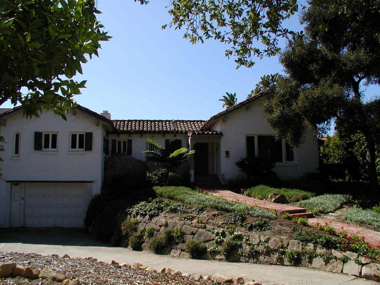 2121 Mission Ridge Road Santa Barbara, CA 93103 - Photo 1 of 5 a front view of a house with a yard