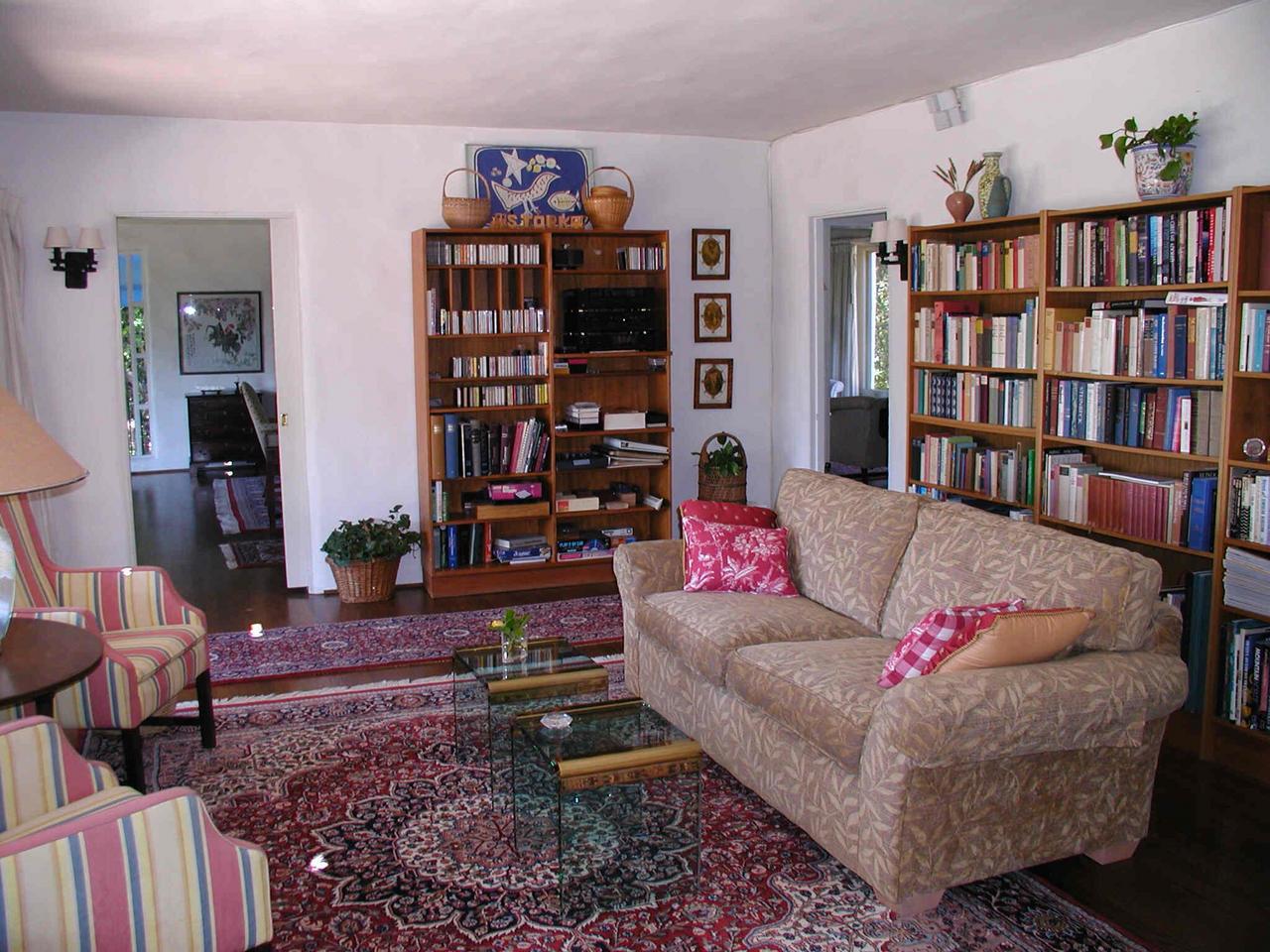 2121 Mission Ridge Road Santa Barbara, CA 93103 - Photo 2 of 5 a living room with furniture and a book shelf