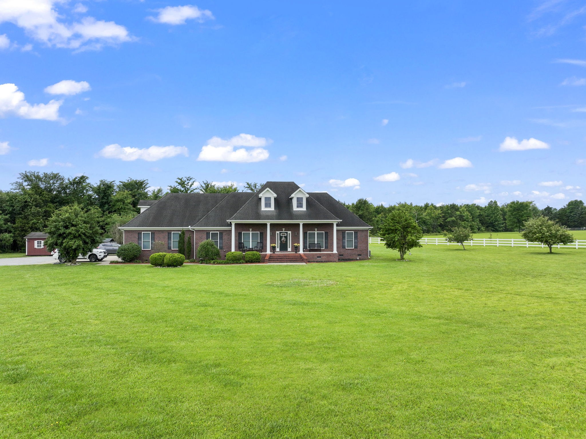 11237 Newtown Road Unionville, TN 37180 - Photo 1 of 46 a view of a big house with a big yard