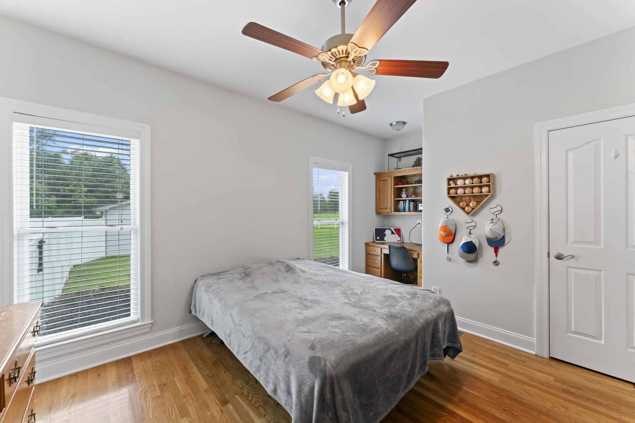 11237 Newtown Road Unionville, TN 37180 - Photo 14 of 46 a bedroom with a bed and a chandelier