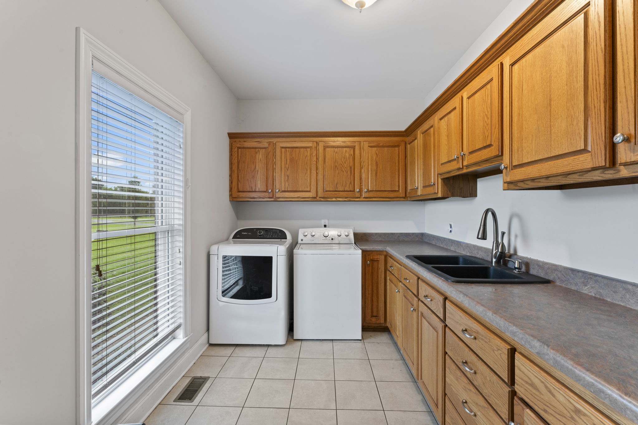 11237 Newtown Road Unionville, TN 37180 - Photo 17 of 46 a kitchen with a sink and cabinets