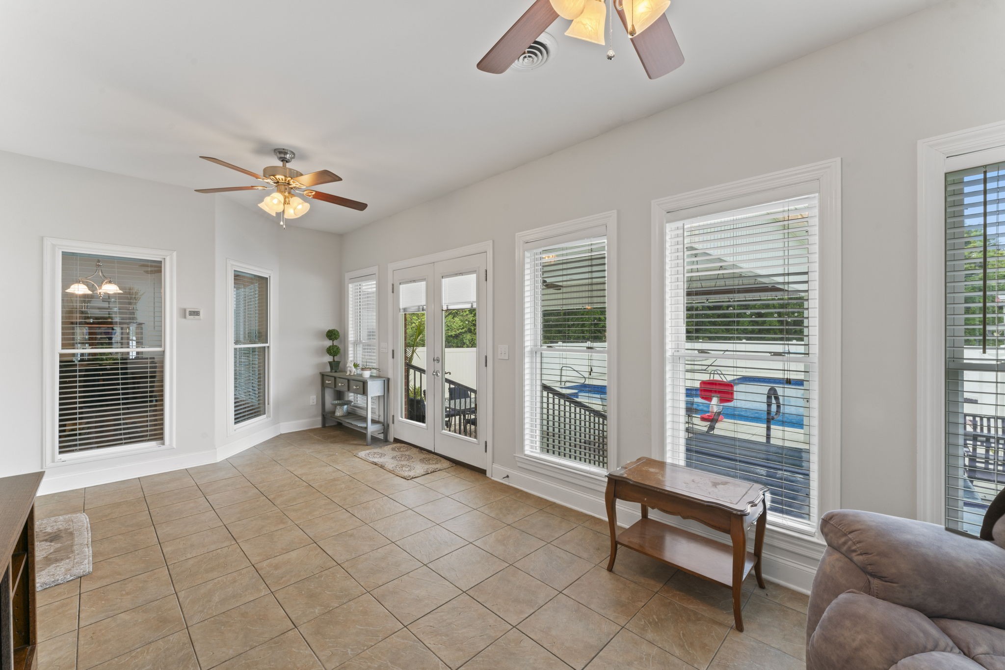 11237 Newtown Road Unionville, TN 37180 - Photo 23 of 46 a living room with furniture a chandelier and a window
