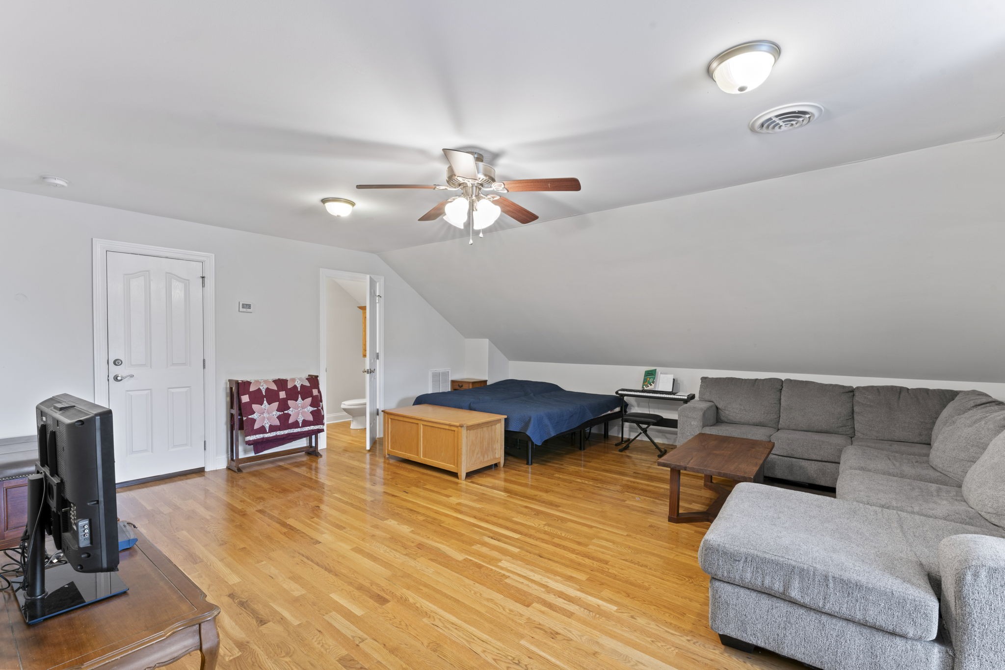 11237 Newtown Road Unionville, TN 37180 - Photo 29 of 46 a living room with furniture and a wooden floor
