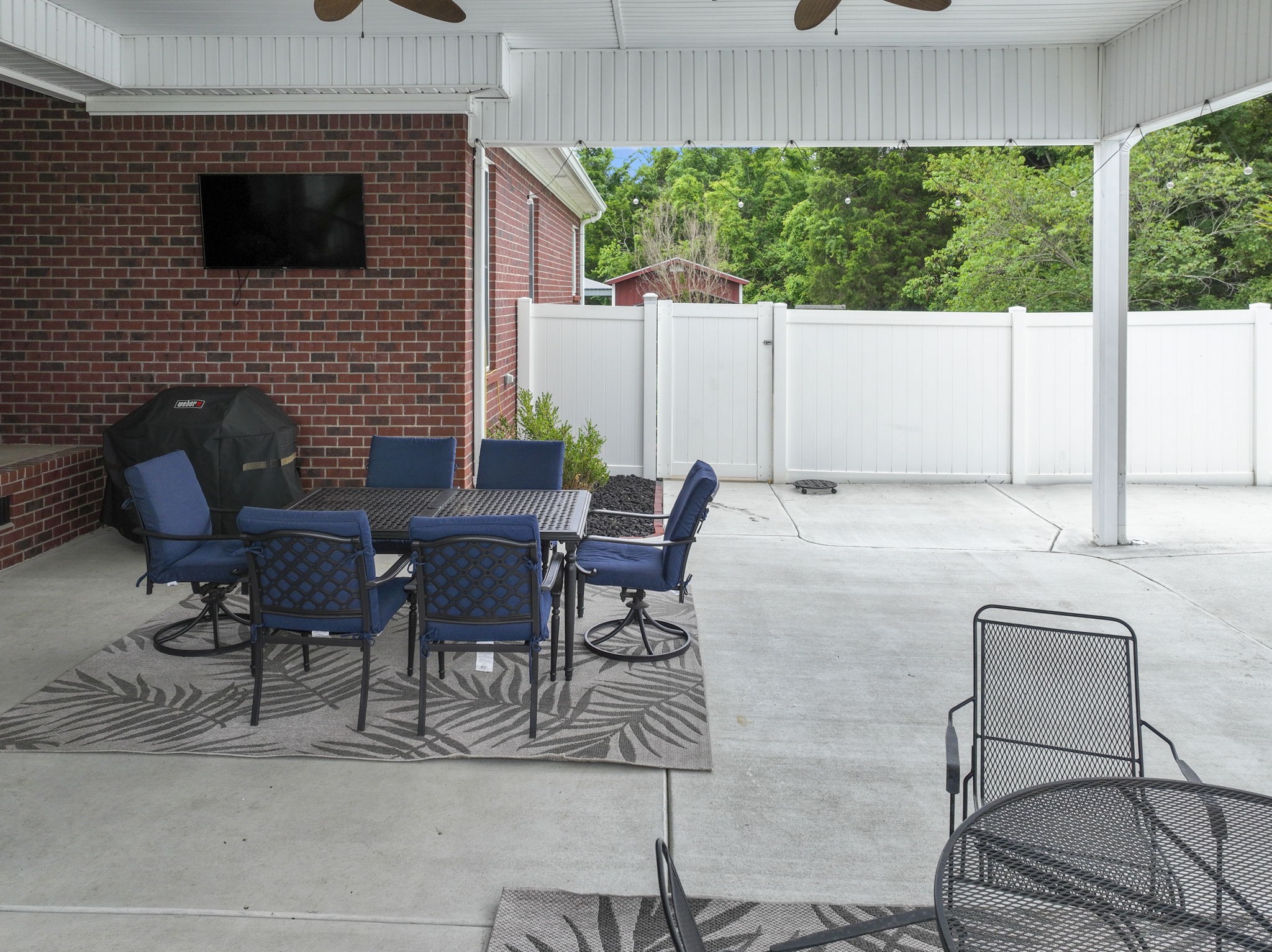 11237 Newtown Road Unionville, TN 37180 - Photo 33 of 46 a backyard of a house with outdoor seating