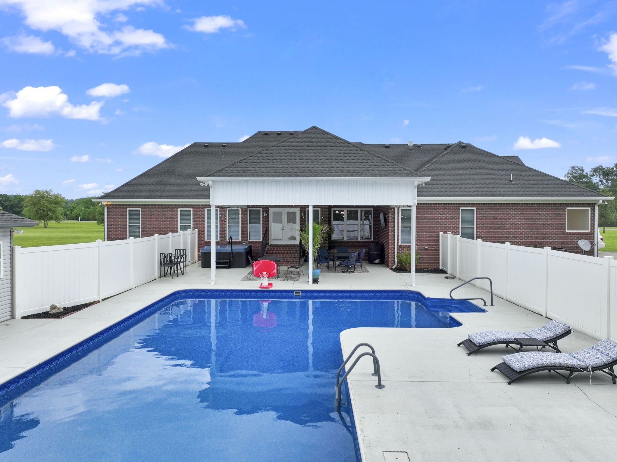 11237 Newtown Road Unionville, TN 37180 - Photo 34 of 46 a view of a house with swimming pool and sitting area