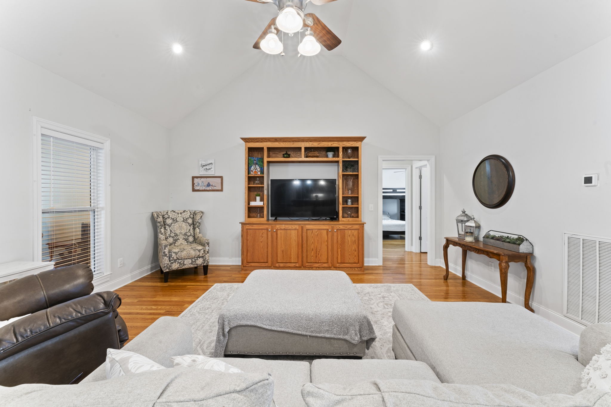 11237 Newtown Road Unionville, TN 37180 - Photo 7 of 46 a bedroom with a large bed and a couch