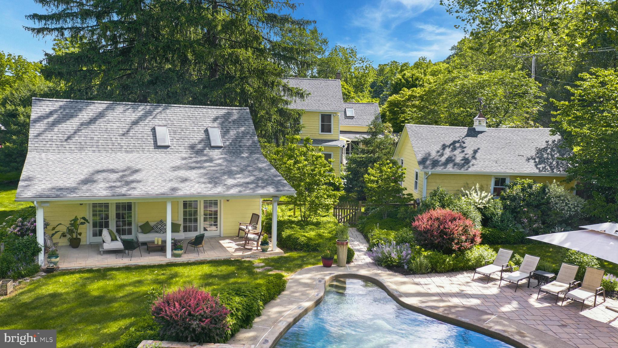 155 Old Philadelphia Road Riegelsville, PA 18077 - Photo 1 of 42 a view of a house with a garden and patio