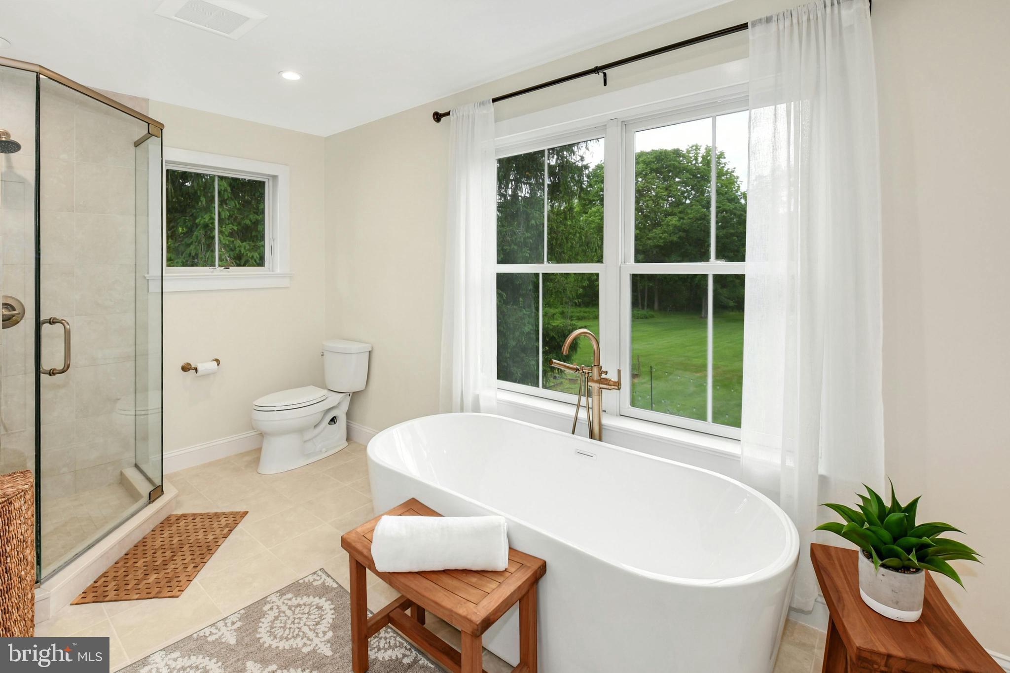 155 Old Philadelphia Road Riegelsville, PA 18077 - Photo 15 of 42 a white bath tub sitting next to a white toilet