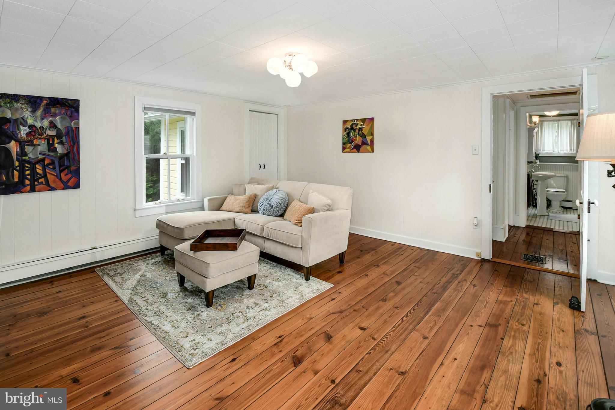 155 Old Philadelphia Road Riegelsville, PA 18077 - Photo 17 of 42 a living room with furniture and wooden floor