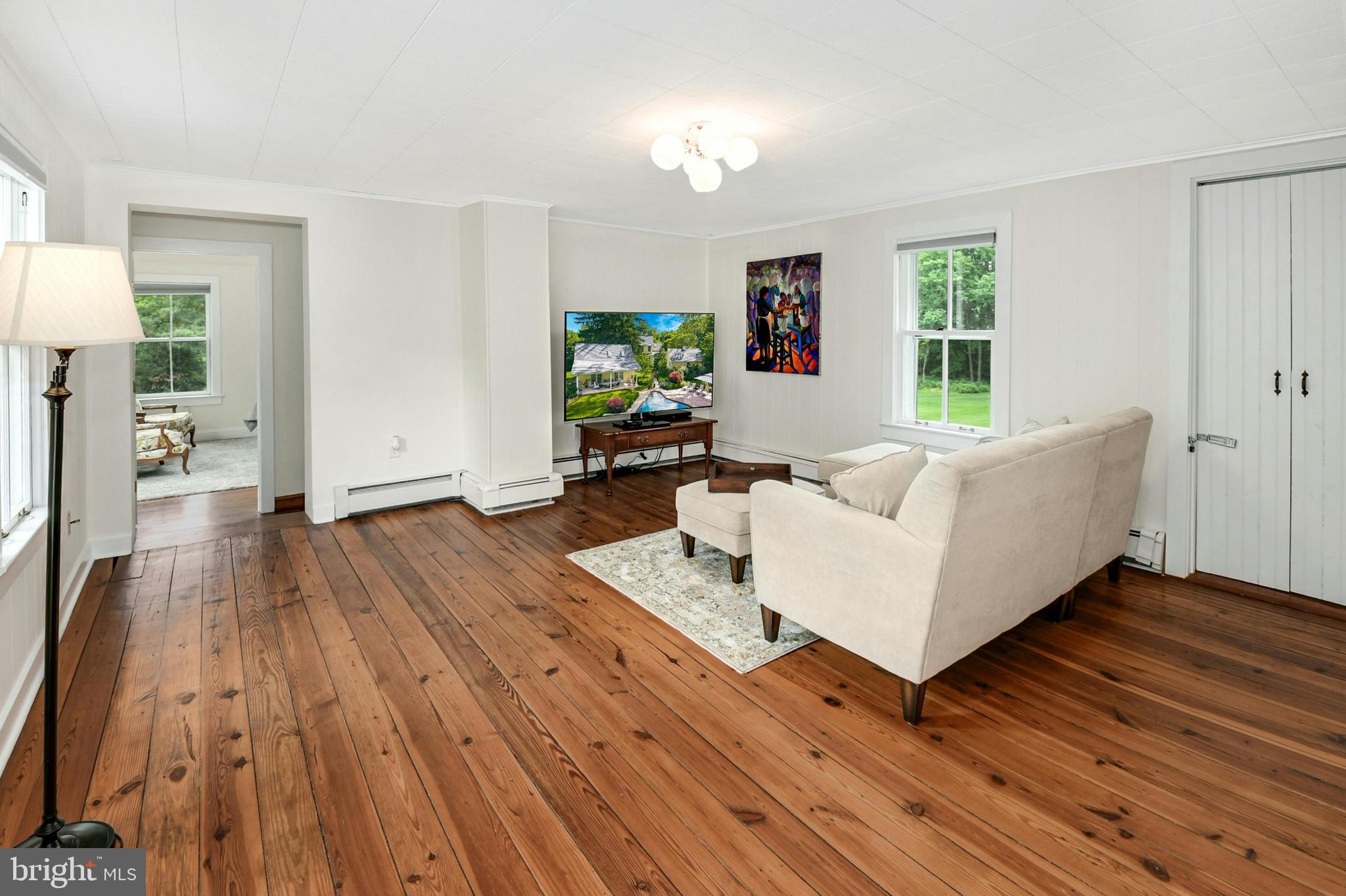 155 Old Philadelphia Road Riegelsville, PA 18077 - Photo 18 of 42 a living room with furniture and a wooden floor