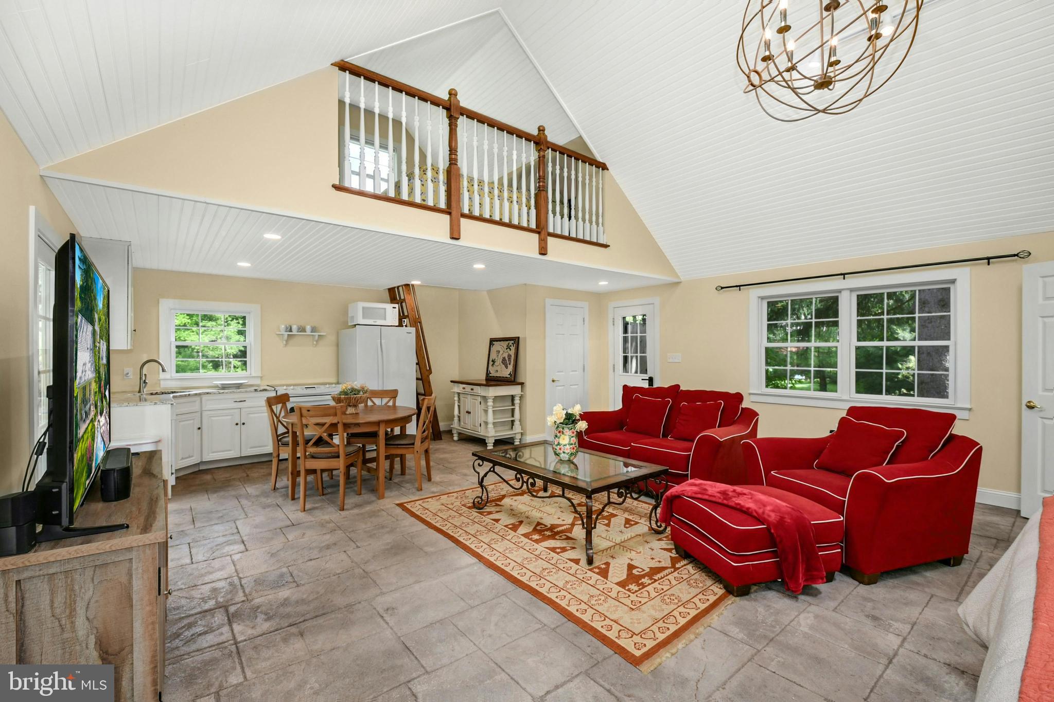 155 Old Philadelphia Road Riegelsville, PA 18077 - Photo 29 of 42 a living room with furniture a window and a flat screen tv