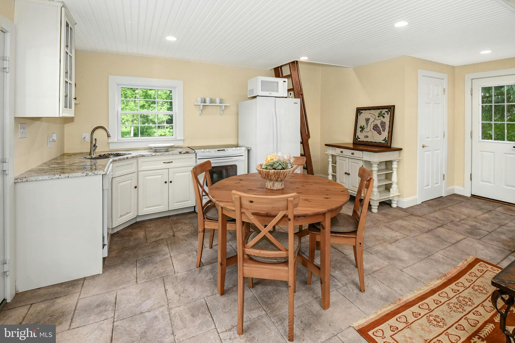 155 Old Philadelphia Road Riegelsville, PA 18077 - Photo 30 of 42 a view of a dining room with furniture and a window