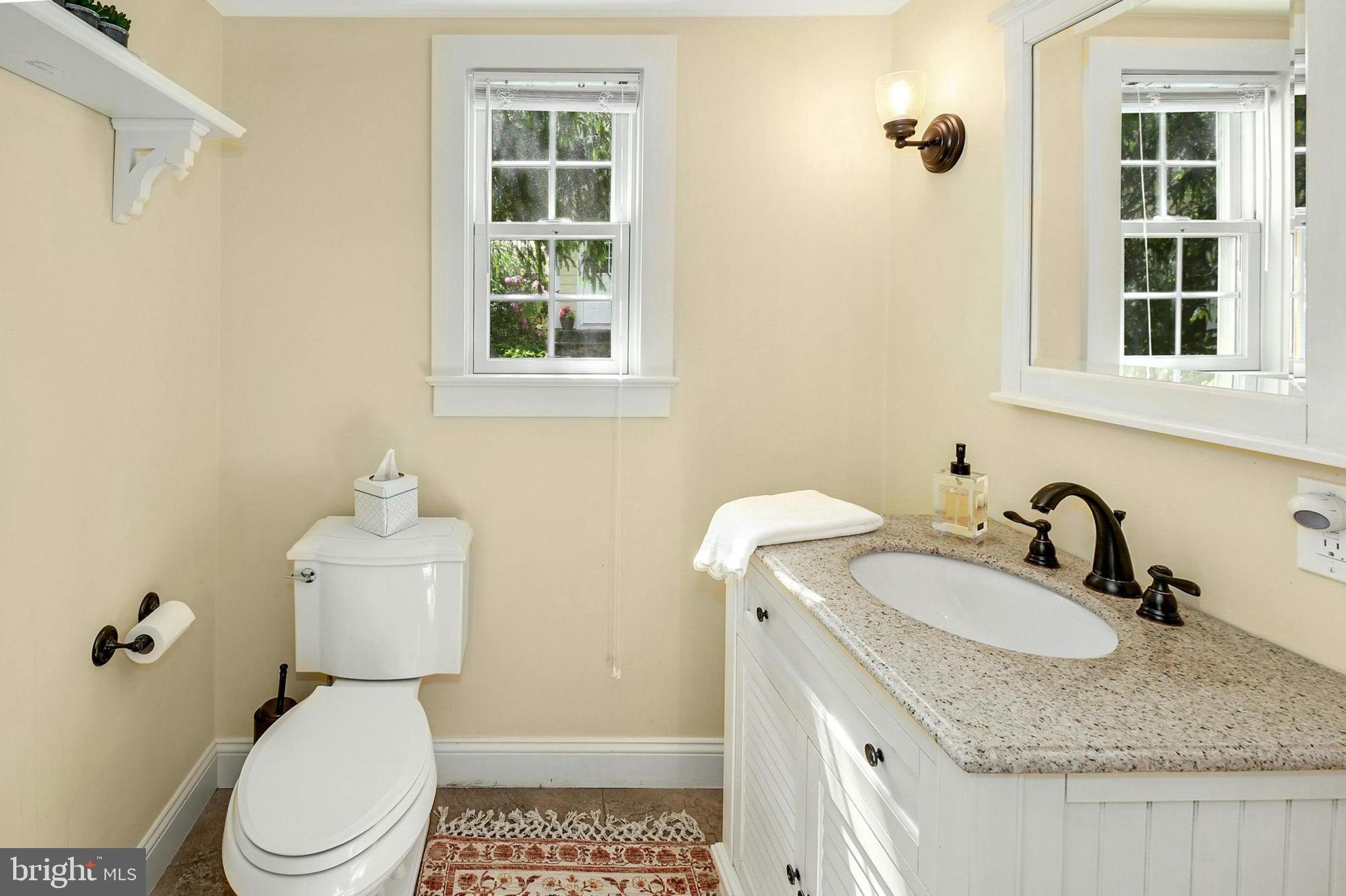 155 Old Philadelphia Road Riegelsville, PA 18077 - Photo 31 of 42 a bathroom with a granite countertop sink and a toilet