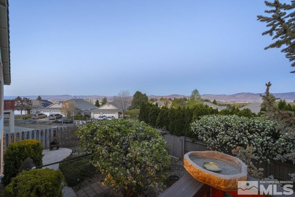 6238 Golden Meadow Road Reno, NV 89519 - Photo 13 of 40 a view of a backyard with plants and a garden