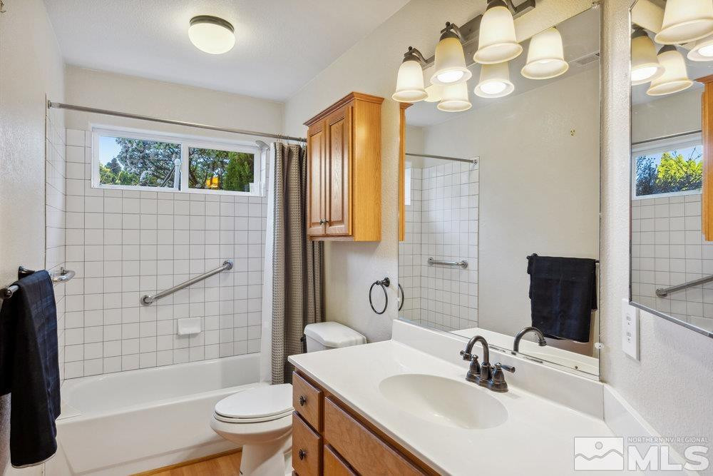 6238 Golden Meadow Road Reno, NV 89519 - Photo 16 of 40 a bathroom with a sink a toilet and shower