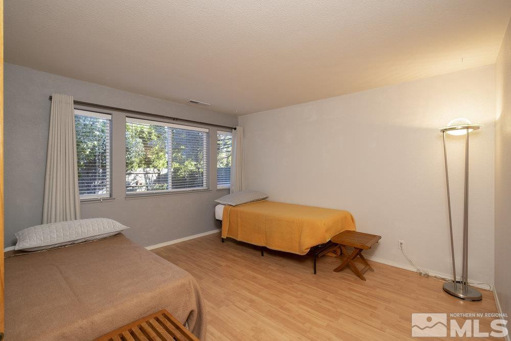 6238 Golden Meadow Road Reno, NV 89519 - Photo 17 of 40 a bedroom with a bed and a window