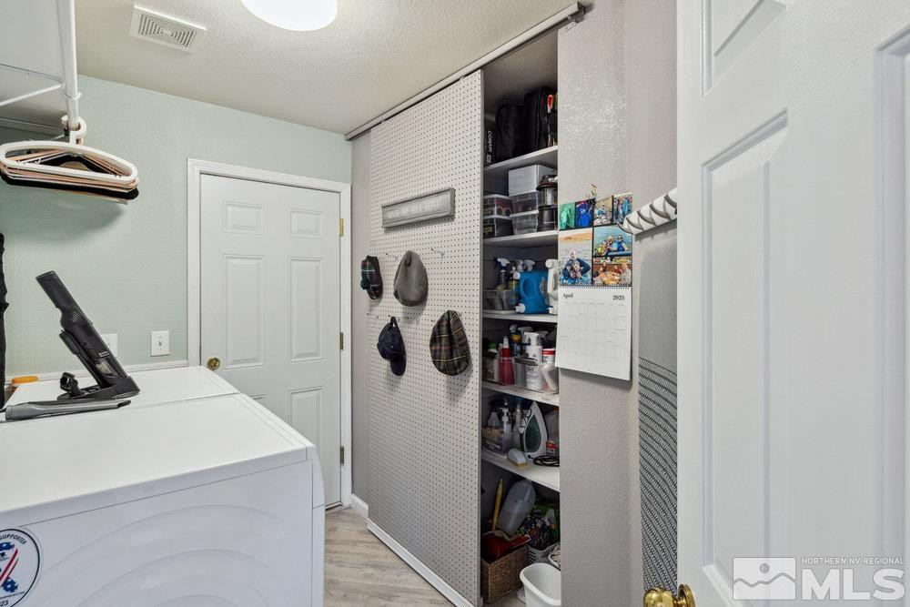 6238 Golden Meadow Road Reno, NV 89519 - Photo 27 of 40 a view of walk in closet with clothes and shoes