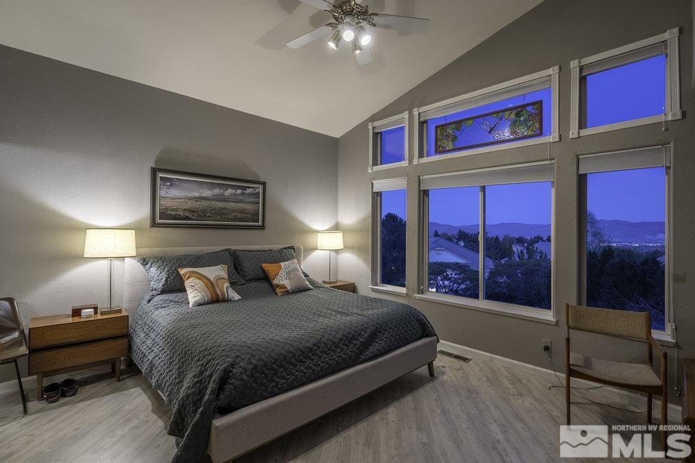 6238 Golden Meadow Road Reno, NV 89519 - Photo 28 of 40 a bedroom with a bed a lamp and window