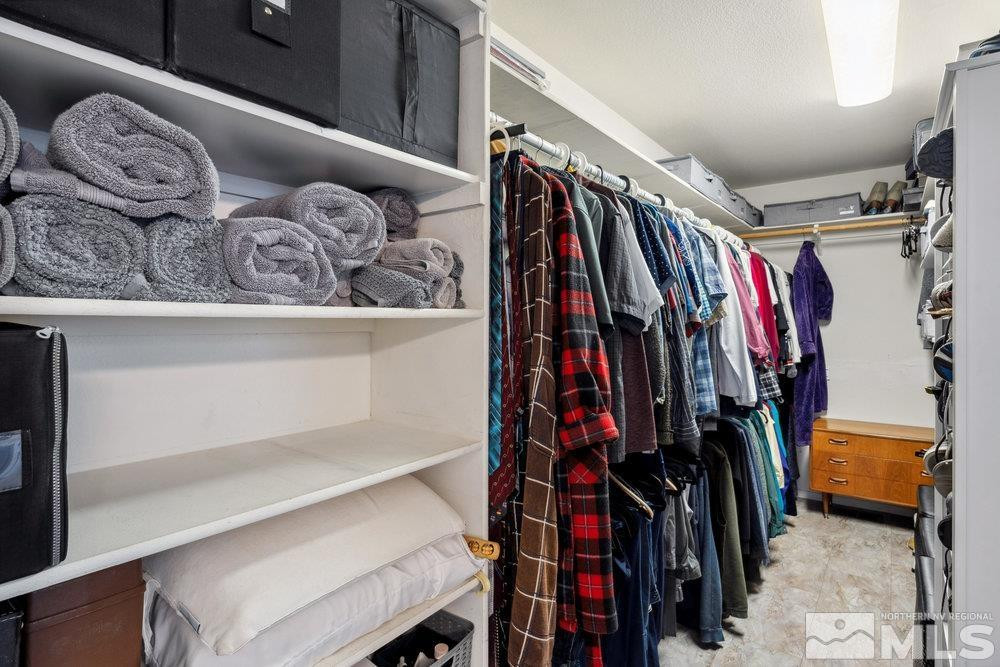6238 Golden Meadow Road Reno, NV 89519 - Photo 30 of 40 a view of walk in closet with clothes and shoes