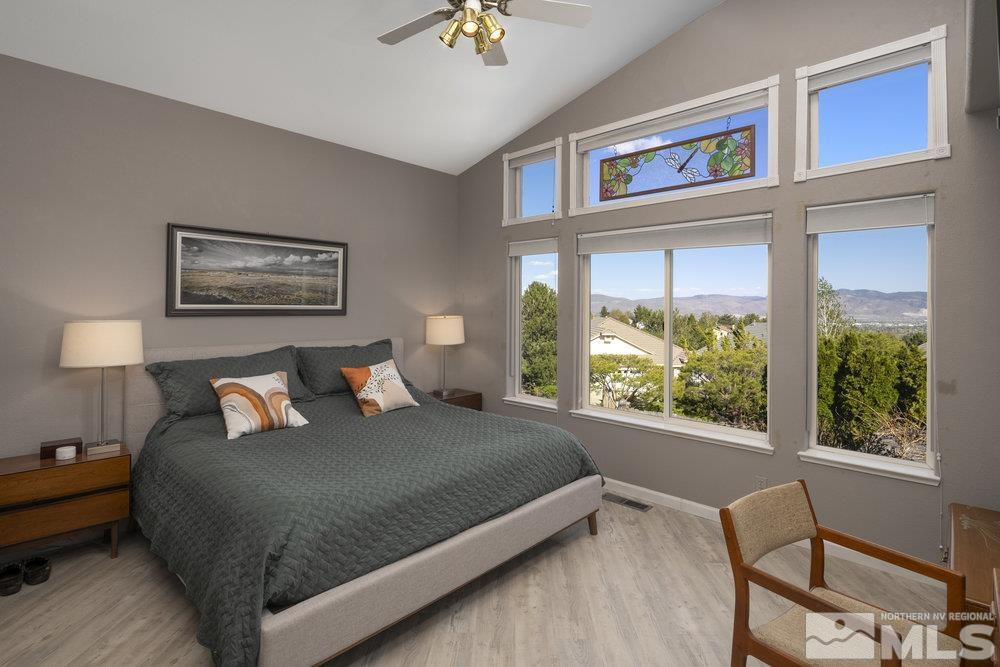 6238 Golden Meadow Road Reno, NV 89519 - Photo 9 of 40 a bed sitting in a bedroom next to a window