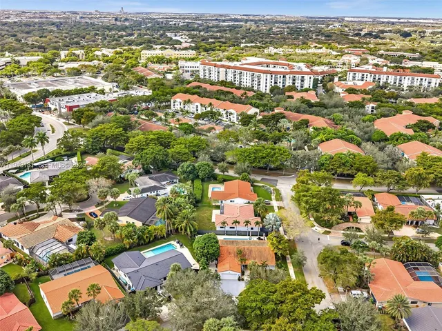 an aerial view of residential houses with outdoor space