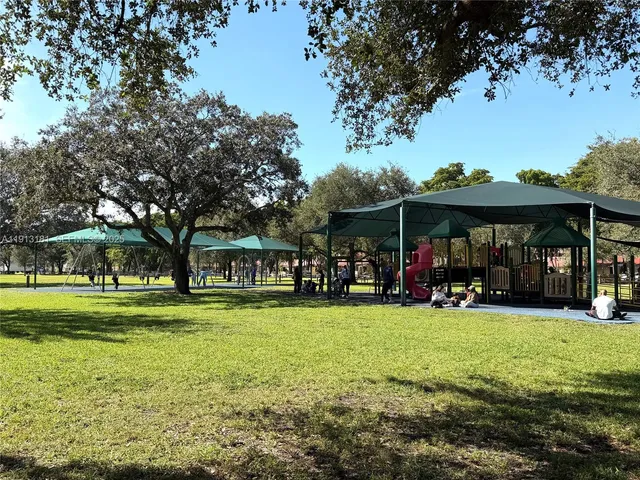 a view of a park with sitting area