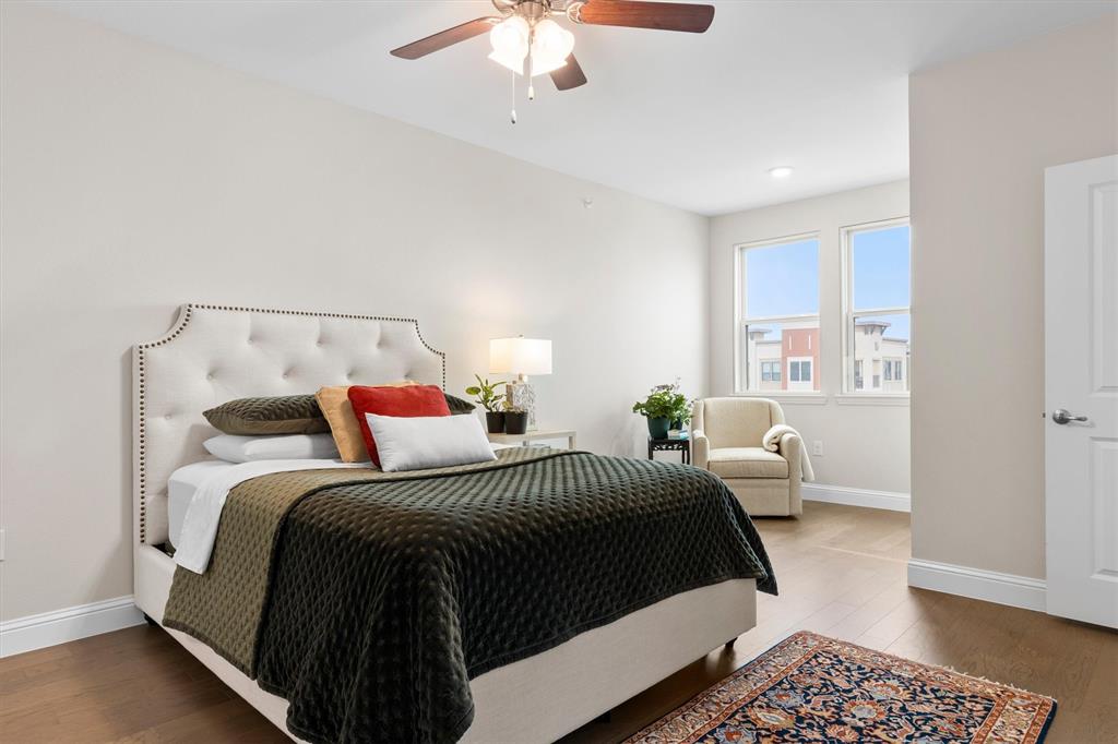 651 Watters Road, Unit 4403 Allen, TX 75013 - Photo 12 of 37 a bedroom with a large bed and a chandelier