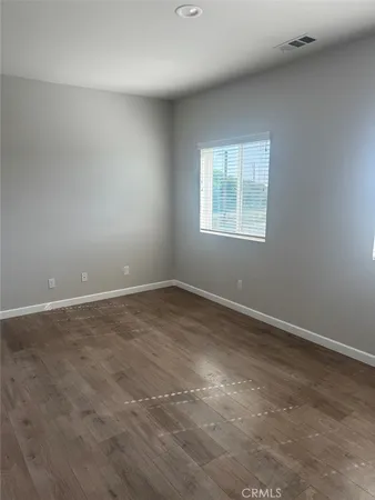 an empty room with closet area