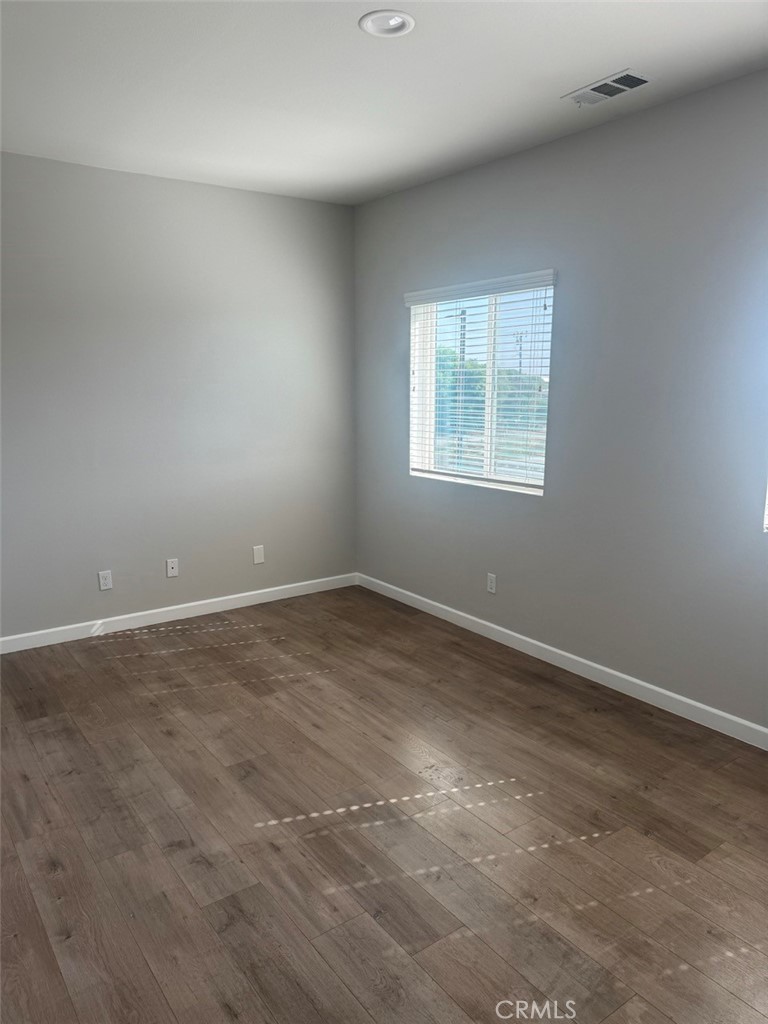 13665 Arrow Route, Unit 6 Fontana, CA 92335 - Photo 26 of 42 an empty room with a window