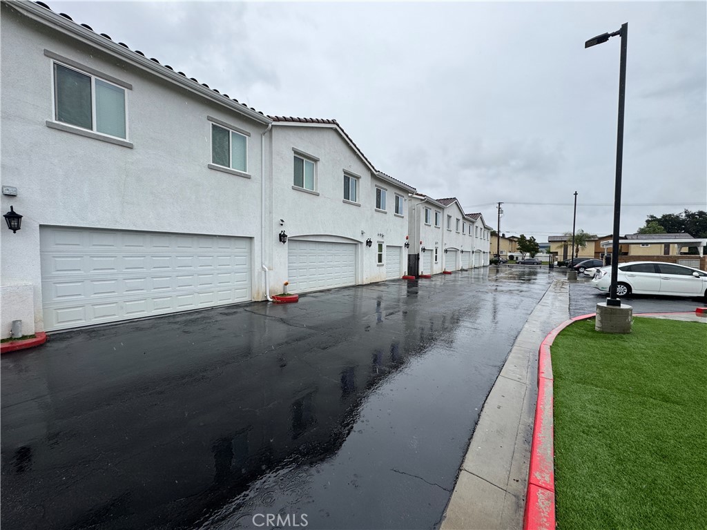 13665 Arrow Route, Unit 6 Fontana, CA 92335 - Photo 7 of 42 a view of a house with a backyard