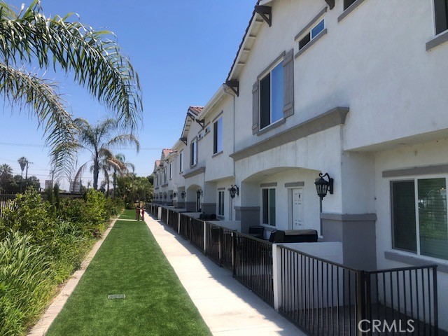 13665 Arrow Route, Unit 6 Fontana, CA 92335 - Photo 8 of 42 a view of a house with a yard