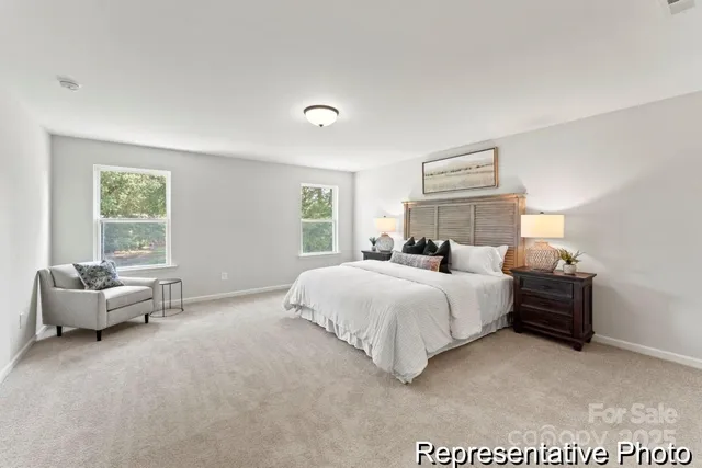 a bedroom with bed and window