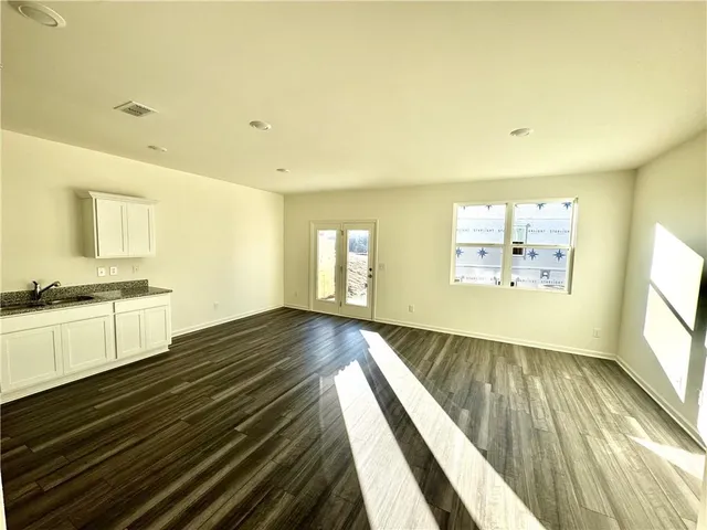 a view of an empty room and window