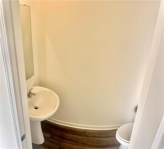 a bathroom with a toilet and a sink