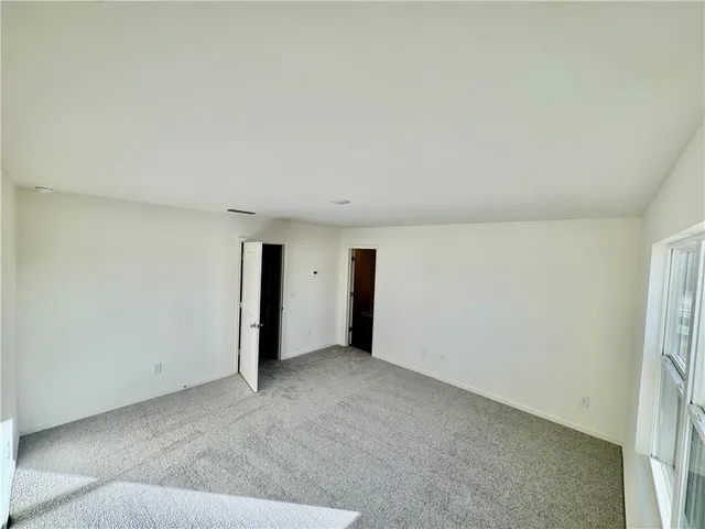 a bathroom with a sink a toilet and a shower