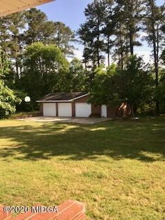 11 Bolingview Road Juliette, GA 31046 - Photo 13 of 14 a house view with swimming pool in front of it