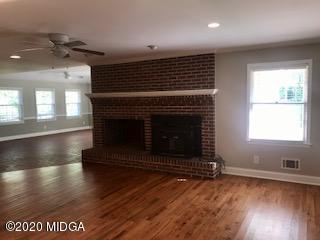 11 Bolingview Road Juliette, GA 31046 - Photo 3 of 14 a view of an empty room with wooden floor a fireplace and a window