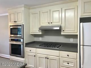 11 Bolingview Road Juliette, GA 31046 - Photo 4 of 14 a kitchen with white cabinets and appliances