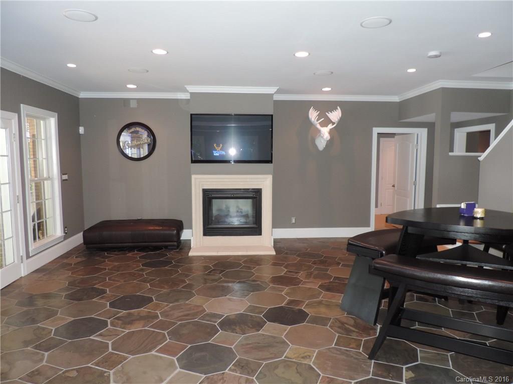 5516 Plantation Ridge Road Charlotte, NC 28214 - Photo 14 of 24 a living room with furniture and a fireplace
